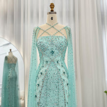 Load image into Gallery viewer, Luxury Dubai Aqua Evening Dress with Cape Sleeves Criss Cross
