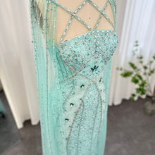 Load image into Gallery viewer, Luxury Dubai Aqua Evening Dress with Cape Sleeves Criss Cross
